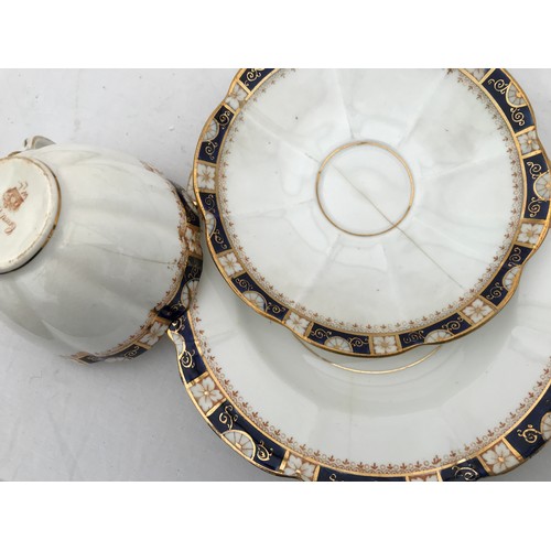 67 - A part tea set of Court China W.L.L. blue and gilt. Thirty eight pieces comprising : 2 cake plates 2... 