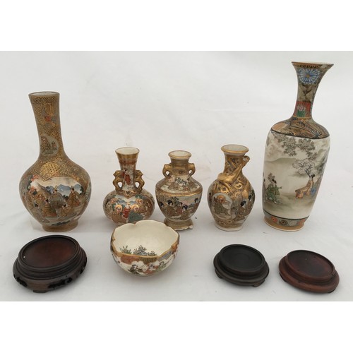 68 - Satsuma ware to include a tall vase 18cms h, gilt vase 15cms h, three small vases: lion handle 9cms ... 