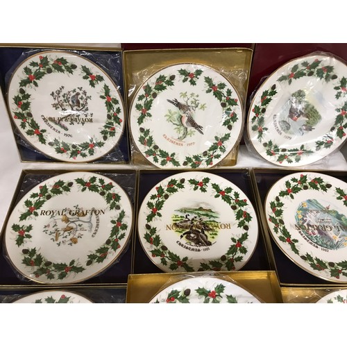 71 - A collection of 12 Royal Grafton decorative wall plates, Christmas 1976 to 1987. 22cms w with packag... 