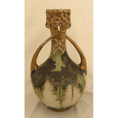 72 - A floral and gilt Austrian  pottery vase marked Turn- Teplitz R.S. & K. with twin handles and pierce... 