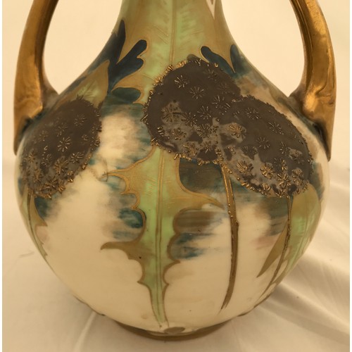 72 - A floral and gilt Austrian  pottery vase marked Turn- Teplitz R.S. & K. with twin handles and pierce... 