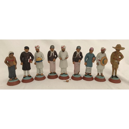 74 - A set of nine Indian clay figurines. Tallest Gurkha 11cms h, smallest lady 9.5cms h.