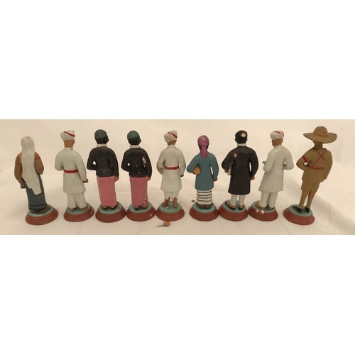 74 - A set of nine Indian clay figurines. Tallest Gurkha 11cms h, smallest lady 9.5cms h.