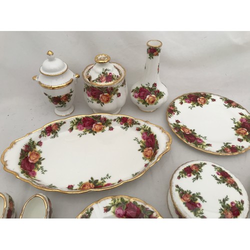 75 - A mixed selection of Old Country Roses comprising 17 pieces : side plate 21cms, saucers 16cms, pin d... 