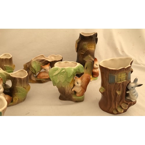 88 - A collection of 7 Withernsea and Hornsea pottery of small woodland animals with tree trunks. Tallest... 