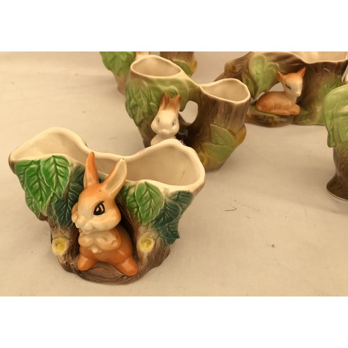 88 - A collection of 7 Withernsea and Hornsea pottery of small woodland animals with tree trunks. Tallest... 