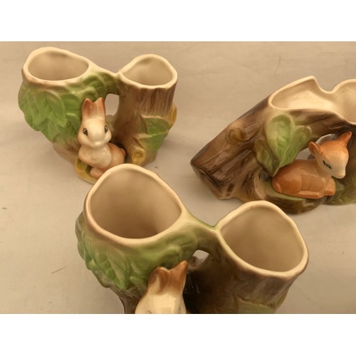 88 - A collection of 7 Withernsea and Hornsea pottery of small woodland animals with tree trunks. Tallest... 