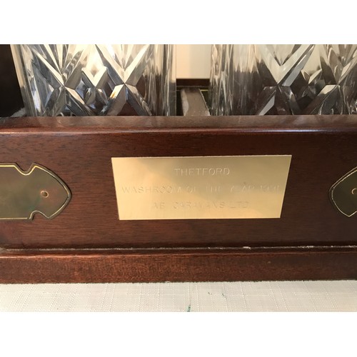 105 - A mahogany cased two bottle tantalus with Royal Doulton crystal glass decanters with key. 29cms h x ... 