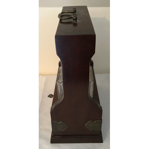 105 - A mahogany cased two bottle tantalus with Royal Doulton crystal glass decanters with key. 29cms h x ... 
