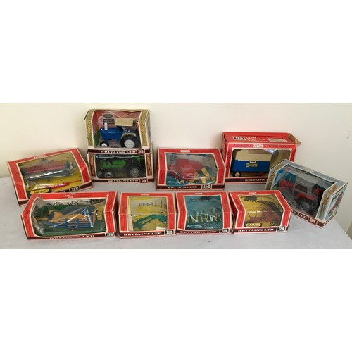 689 - A collection of Britains Ltd metal and plastic 1.32 model tractors, trailers and farm implements. Te... 