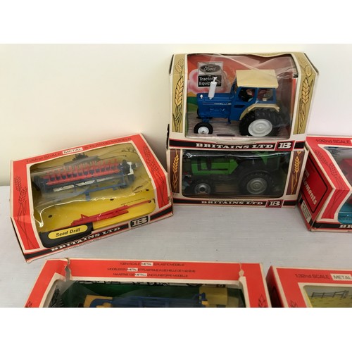 689 - A collection of Britains Ltd metal and plastic 1.32 model tractors, trailers and farm implements. Te... 