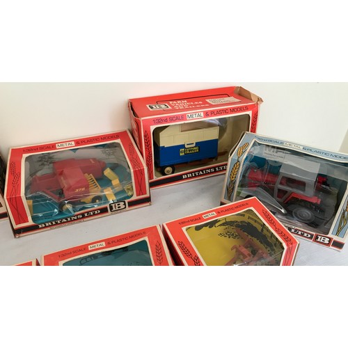 689 - A collection of Britains Ltd metal and plastic 1.32 model tractors, trailers and farm implements. Te... 