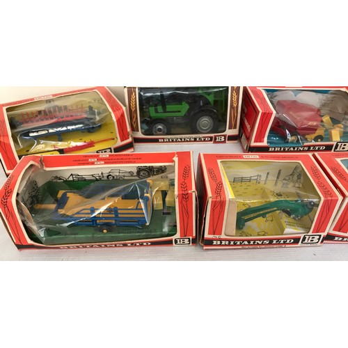 689 - A collection of Britains Ltd metal and plastic 1.32 model tractors, trailers and farm implements. Te... 