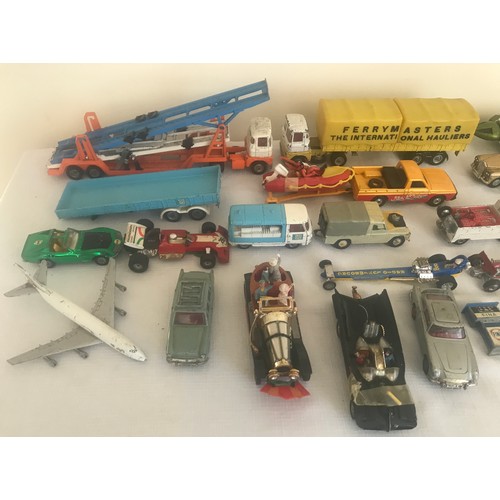 694 - A collection of Corgi and Dinky Diecast vehicles, 17 Corgi including Chitty Chitty Bang Bang, Batmob... 