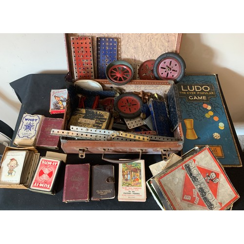 700 - A quantity of games and toys to include vintage Meccano, Monopoly, card games and Merlin game.