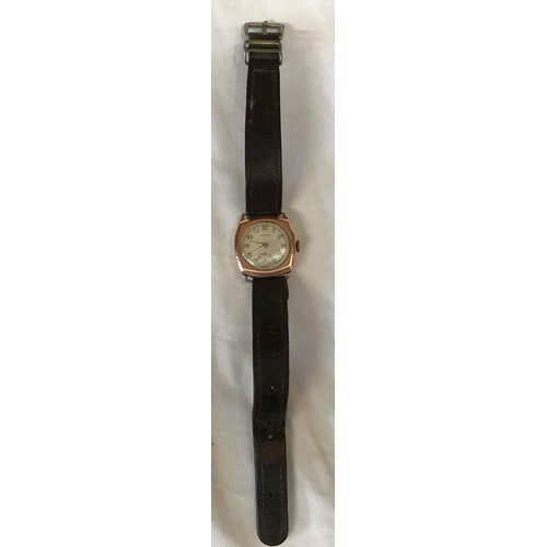 710 - A 9ct gold cased Shield wristwatch with leather strap. Stamped to inner case 375. Case size 27mm. di... 