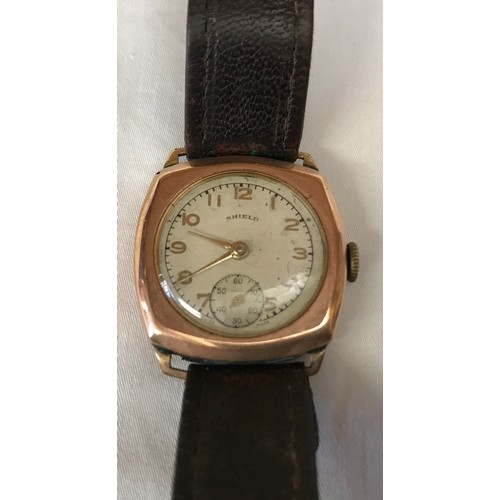 710 - A 9ct gold cased Shield wristwatch with leather strap. Stamped to inner case 375. Case size 27mm. di... 