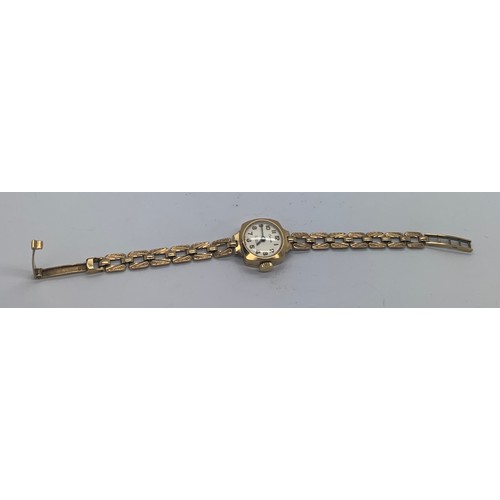 720 - A 9ct gold Chateau Lady's wristwatch and strap. Total weight 12.5gms.