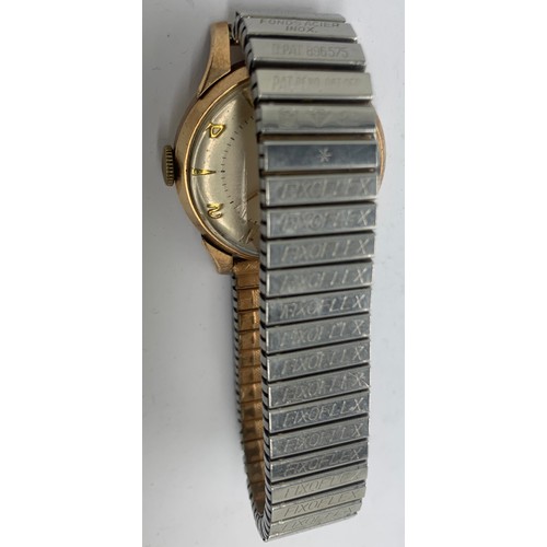 723 - A Smiths deluxe 9ct gentlemen's wristwatch with expanding gilt bracelet. Total weight 54.6gms.