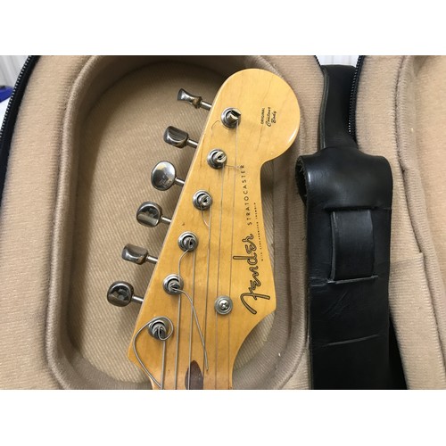 735 - A Fender Stratocaster Electric Guitar. Japanese made, number A001532. Two tone original body with tr... 