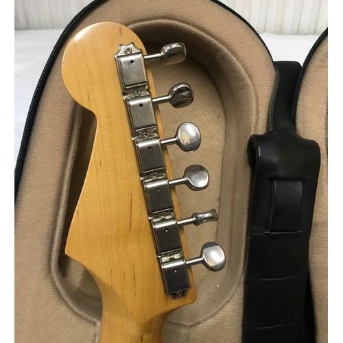 735 - A Fender Stratocaster Electric Guitar. Japanese made, number A001532. Two tone original body with tr... 