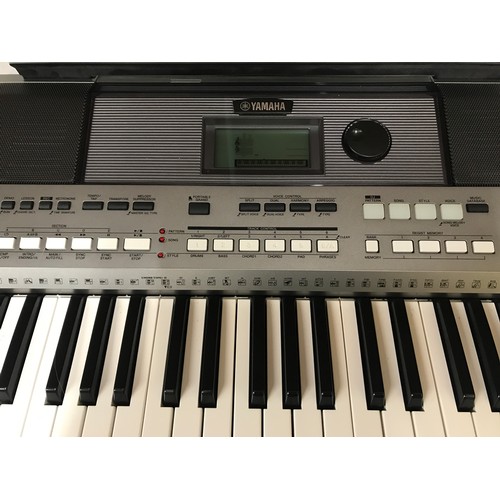 738 - A Yamaha Keyboard PSR E443. Digital with keyboard stand and manual booklets.