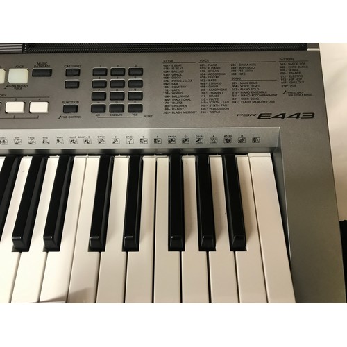 738 - A Yamaha Keyboard PSR E443. Digital with keyboard stand and manual booklets.