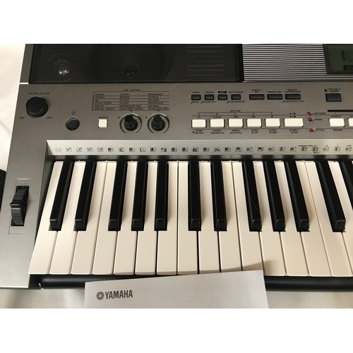 738 - A Yamaha Keyboard PSR E443. Digital with keyboard stand and manual booklets.