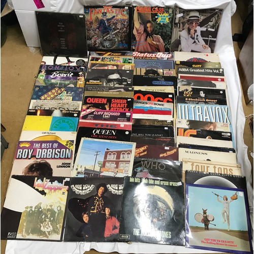 741 - A collection of 60 vinyl LP records of British 70's & 80's rock charts by various artists to include... 