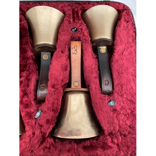 744 - Two cased sets of hand ringing bells. Larger case of 16 bells containing : 12 marked Whitechapel to ... 