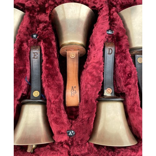 744 - Two cased sets of hand ringing bells. Larger case of 16 bells containing : 12 marked Whitechapel to ... 