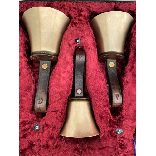 744 - Two cased sets of hand ringing bells. Larger case of 16 bells containing : 12 marked Whitechapel to ... 