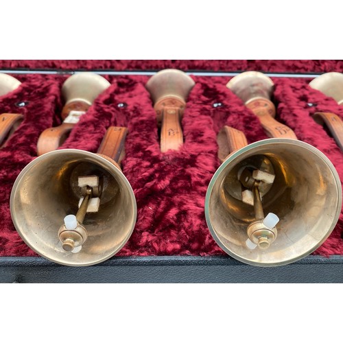 744 - Two cased sets of hand ringing bells. Larger case of 16 bells containing : 12 marked Whitechapel to ... 