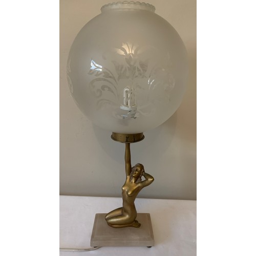 746 - An Art Deco spelter female figural table lamp on white onyx base with associated glass shade. 28cms ... 