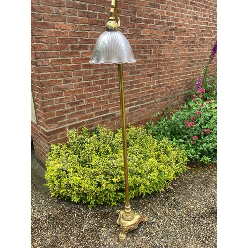 748 - A good quality Edwardian brass standard lamp with clear glass shade. 167cms h.