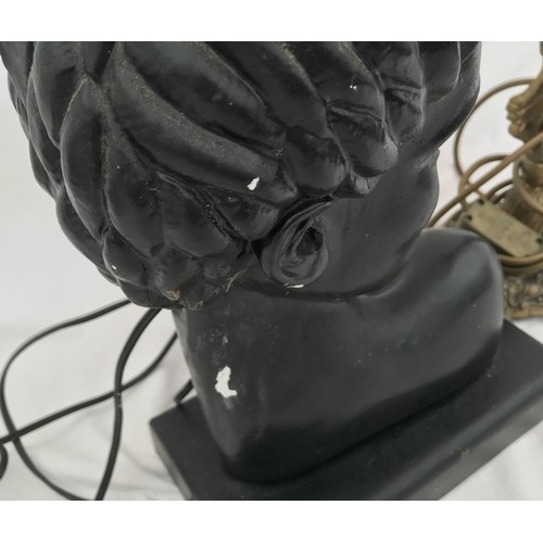 752 - Two table lamps. A black painted pottery bust of an African lady 40cms h to light fitting together w... 