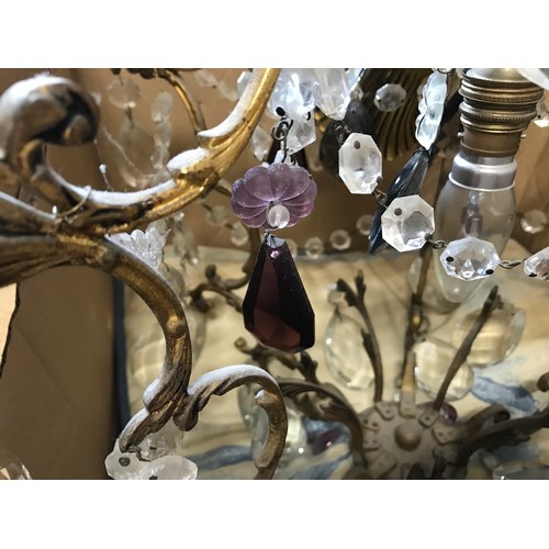 762 - A decorative brass ceiling chandelier with glass droplets, some purple. Approx. 62cms drop.