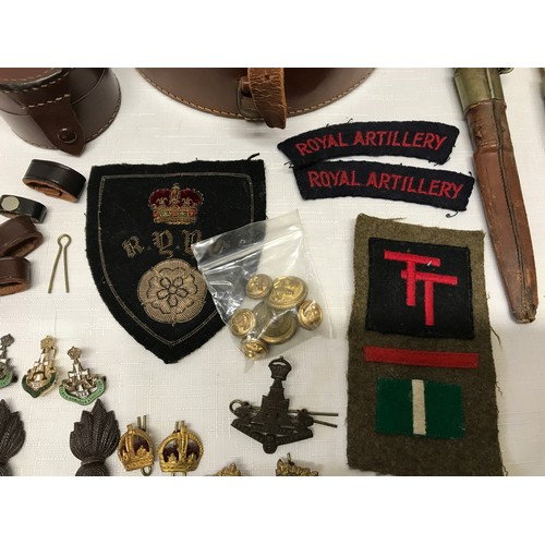 855 - A selection of WWII military patches and badges to include Ubique, Green Howards enamel badges, York... 