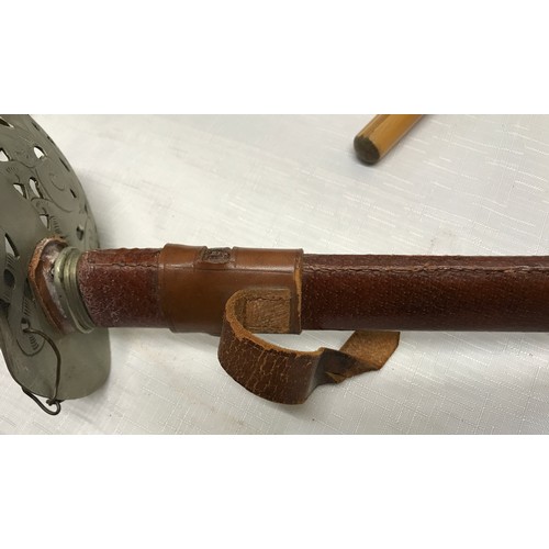 856 - A WWII military officers George VI sword with leather knot and scabbard, leather belt and straps, ca... 