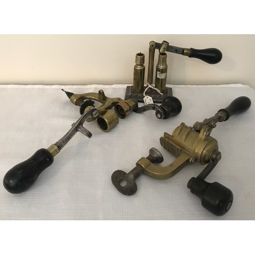 860 - Three brass shotgun cartridge vice re loaders, one James Dixon and Sons, cast iron base, two lever a... 