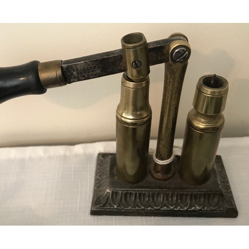 860 - Three brass shotgun cartridge vice re loaders, one James Dixon and Sons, cast iron base, two lever a... 