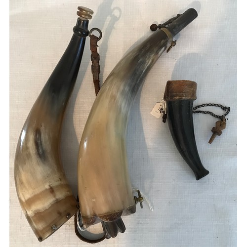 865 - Three gunpowder horns, largest 33cms l, 28cm and small 13cm length.