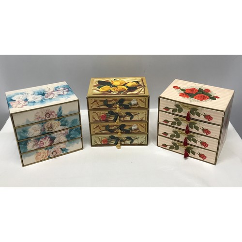 909 - A collection of 3 floral cardboard 4 draw jewellery boxes with decorative design to all 3 and pull t... 