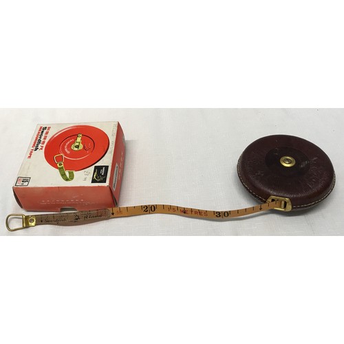 912 - A Swordfish 15m leather measuring tape with original box together with a wooden technical 14cm ruler... 