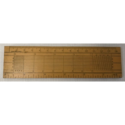 912 - A Swordfish 15m leather measuring tape with original box together with a wooden technical 14cm ruler... 