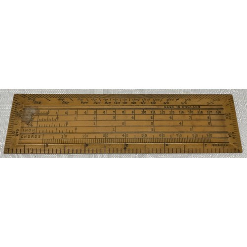 912 - A Swordfish 15m leather measuring tape with original box together with a wooden technical 14cm ruler... 