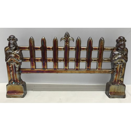 919 - Lustre metal fire front with knight supports 48cms l x 26cms h x 7cmsd.