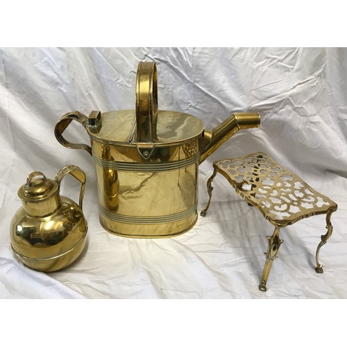 920 - A selection of brassware to include a large watering can 41cms h to handle, a trivet stand 18cms h a... 