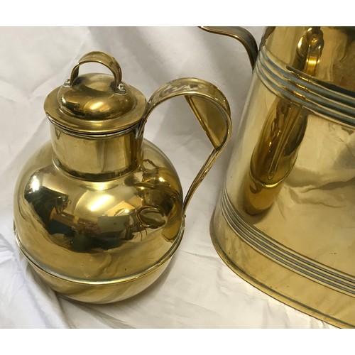 920 - A selection of brassware to include a large watering can 41cms h to handle, a trivet stand 18cms h a... 