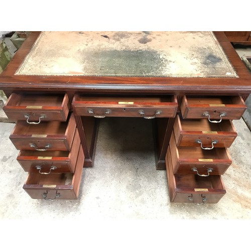 1362 - A mahogany twin pedestal desk with leather inlet top and nine drawers with locks but no key. 122cms ... 